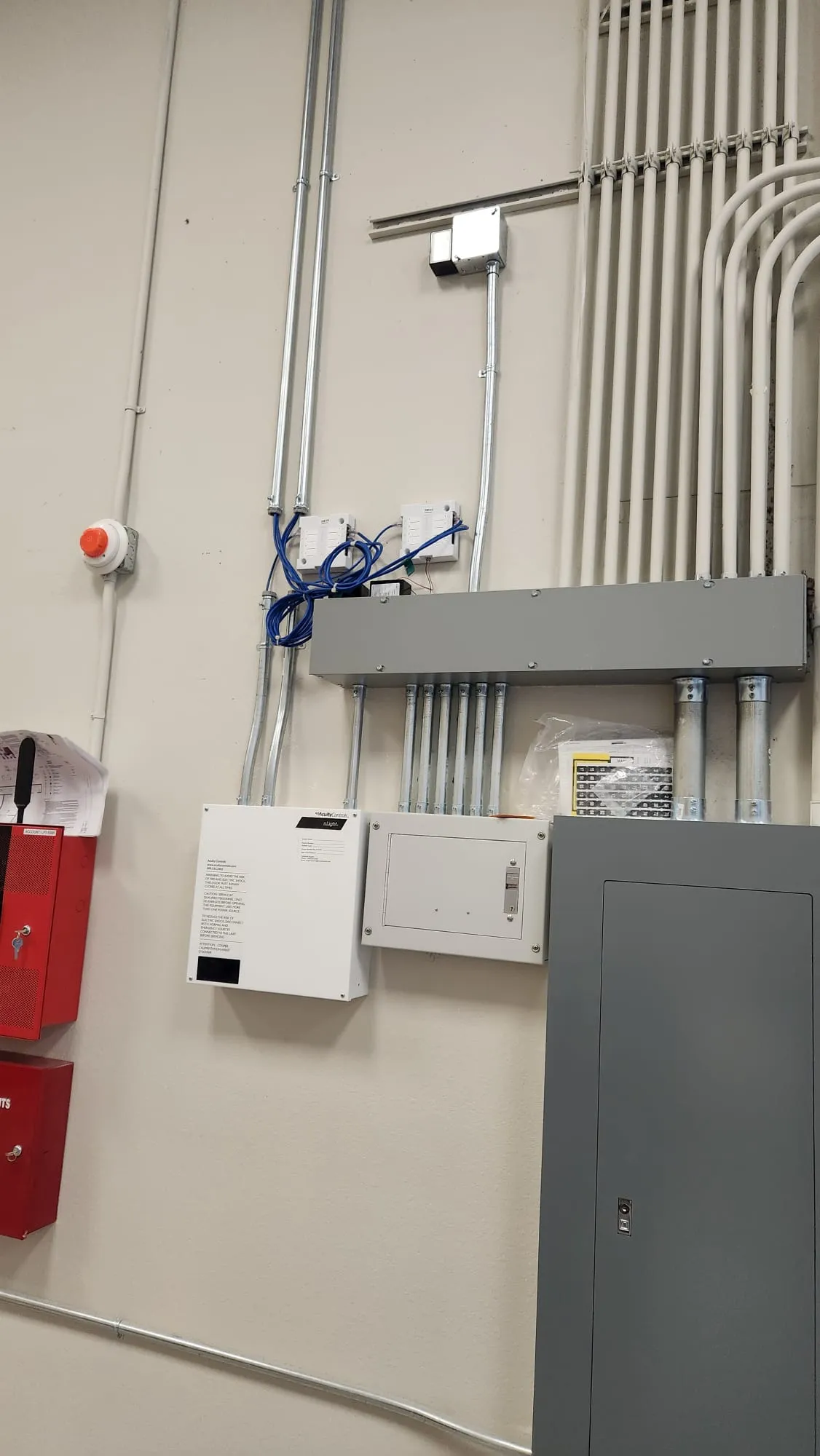Industrial electrical control room with conduit, controls and fire alarm panel. Martinez Electric Corp